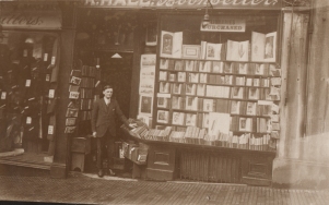 Postcard of Harry Pratley outside Hall's Bookshop circa 1920s.